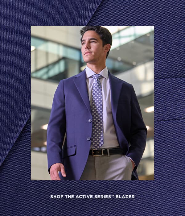Man poses in blue jacket and text says "Shop the Active Series Blazer"