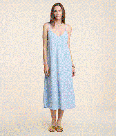 Image shows a model wearing the Lumae Top in Milk/Navy. Image shows a model wearing the Hope Dress in Billow.