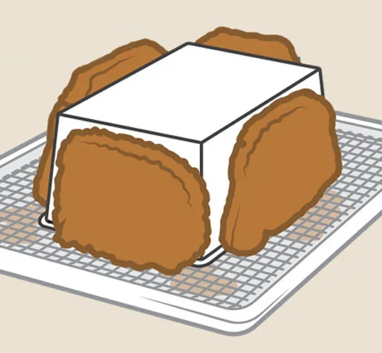 Illustration of leaning cooked tonkatsu against a loaf pan