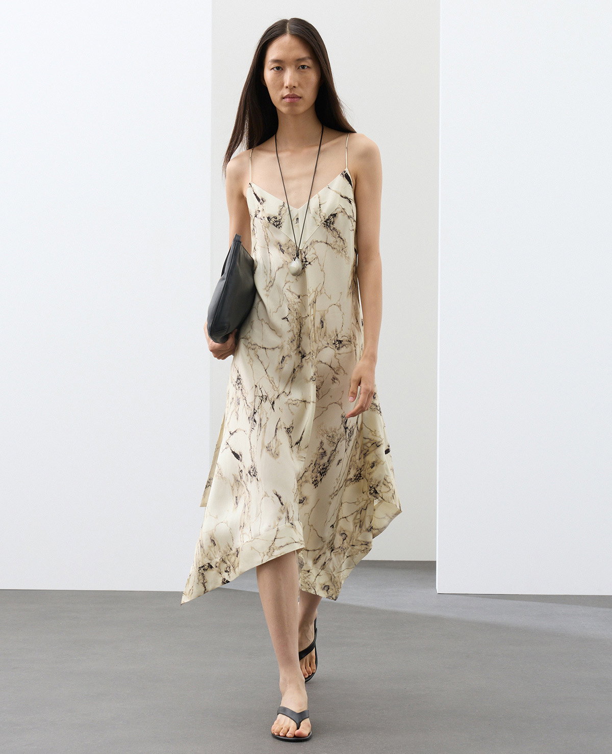 Woman wearing a Cream Mix Cupro Rich Printed Asymmetric Midi Slip Dress
