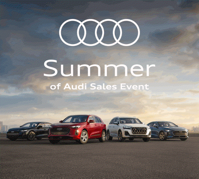 Audi pack shot in front of a summer sky. Audi Q5 driving down a desert road. Audi Q7 speeding through a forest. Audi A5 parked beside a sandy beach. Summer of Audi Sales Event. Explore the lineup.