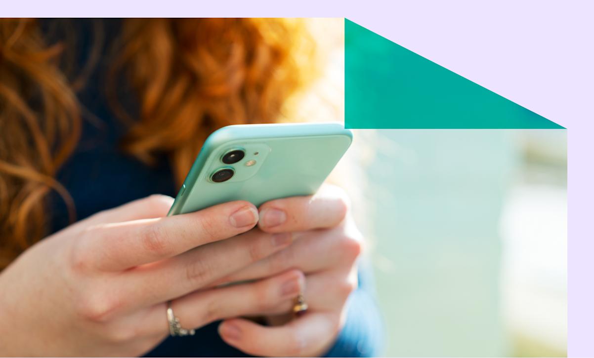 A close-up of a woman using a smartphone