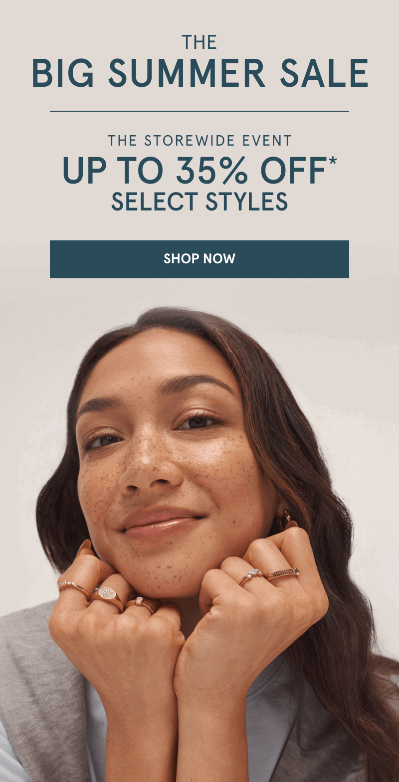 Woman wearing yellow gold diamond fashion rings. The big summer sale. Up to 35% Off select styles. Click shop now.