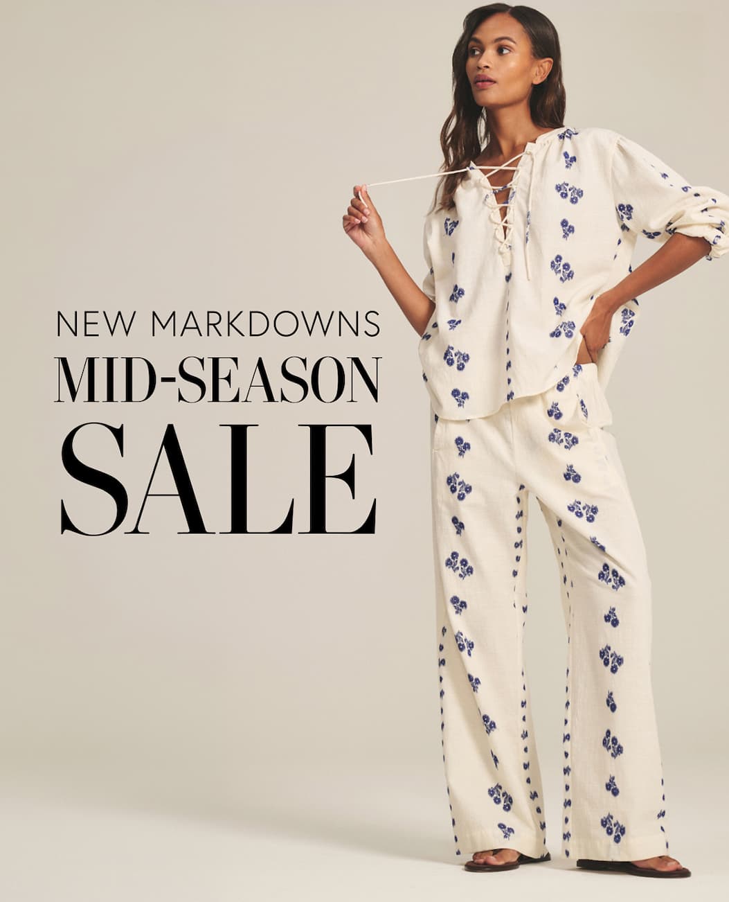 Image shows a model wearing the Winslet Top in Cream/Cobalt. Text reads: New Markdowns. Mid-Season Sale.