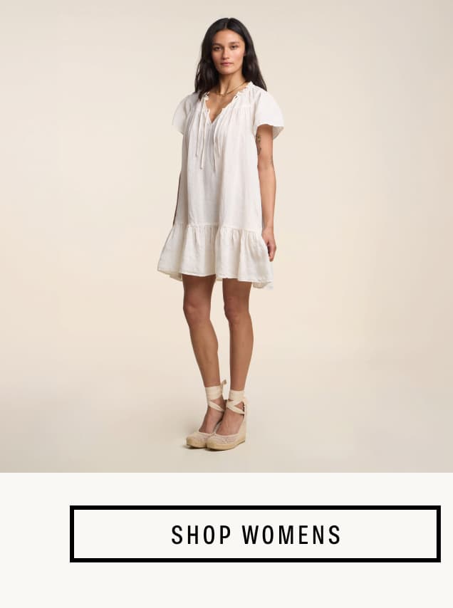 Image shows a model wearing the Livvy Linen Dress in Beach. Button Reads: Shop Women's Sale