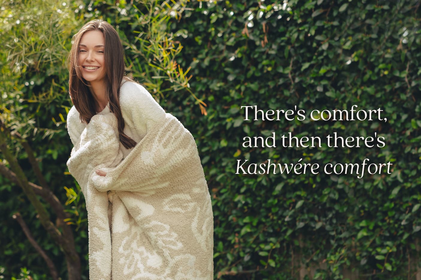 There's comfort and then there's Kashwere comfort. Image of model holding Damask Throw.