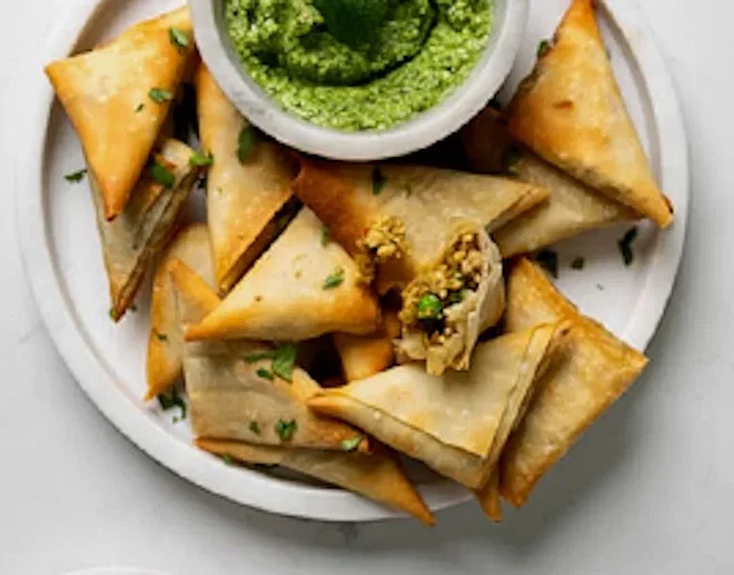 Chicken samosas with minty coriander chutney