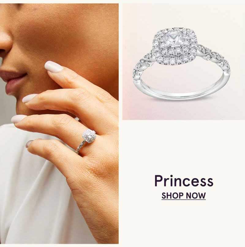 Rectangular-shaped diamond on multi-row pavé diamond band.  Emerald. Click here to shop now