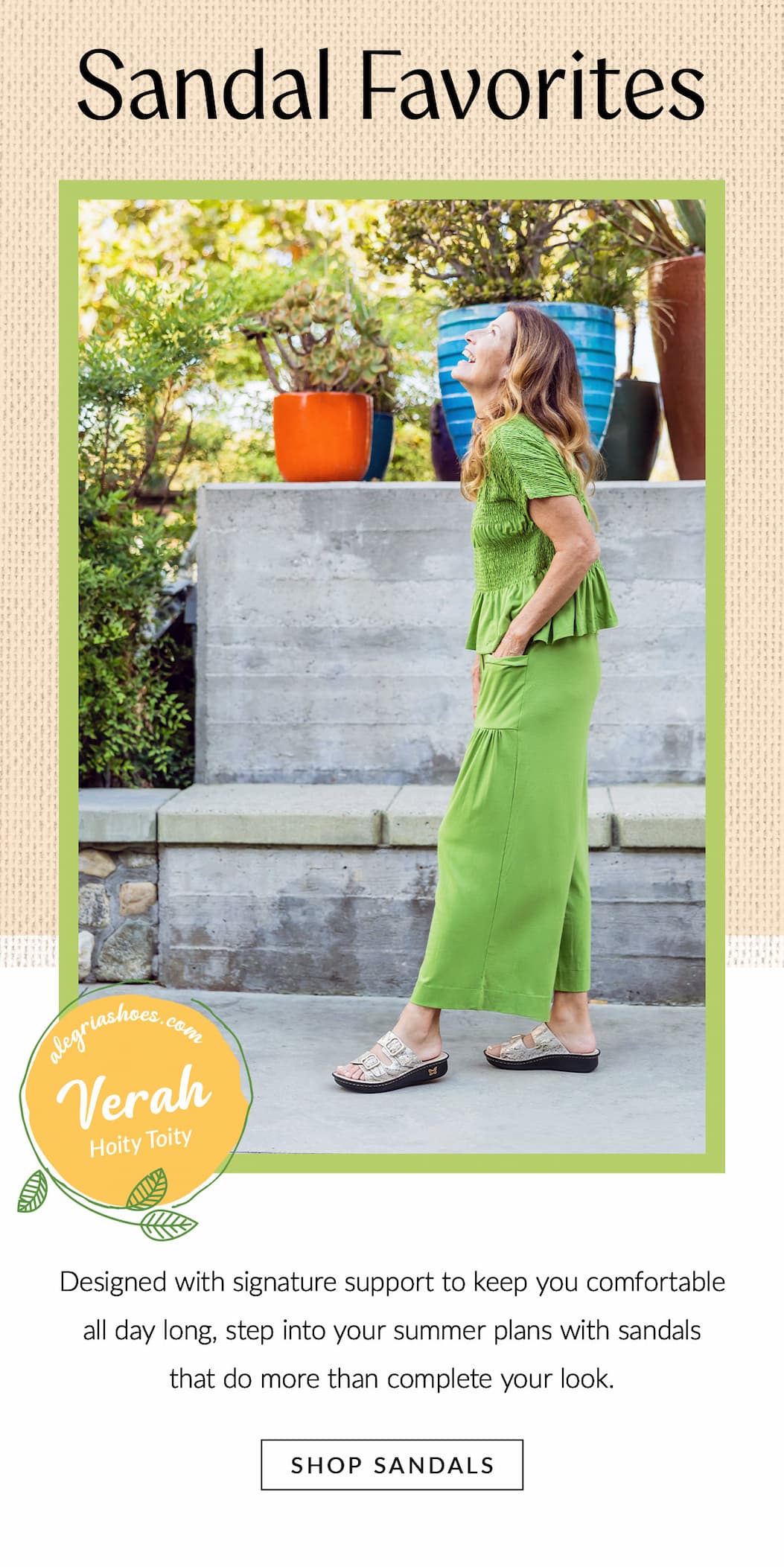 Woman wearing Alegria Verah slide sandals in the Hoity Toity print with a bright green outfit, walking outdoors to showcase supportive sandals designed for all-day summer comfort.