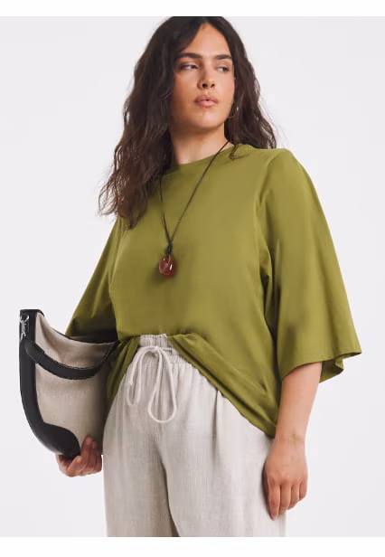 New in top in olive green