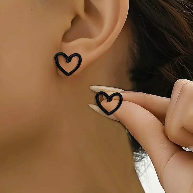 Image of Glossy Hollow Heart Design Stud Earrings