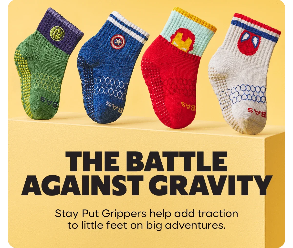 THE BATTLE AGAINST GRAVITY. Stay Put Grippers help add traction to little feet on big adventures.