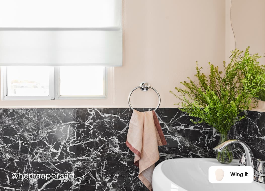 Powder room featuring barely-there pink paint color Wing It