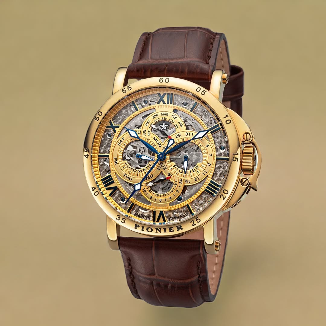 Gold color watch with brown leather band.