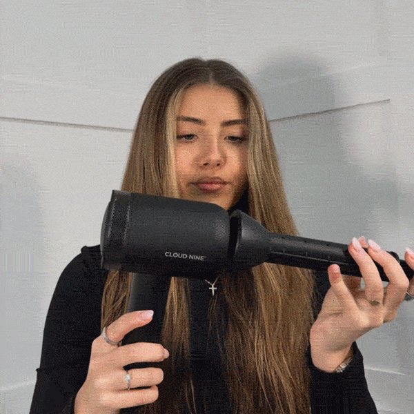 A GIF featuring the Volumiser Attachments styling hair