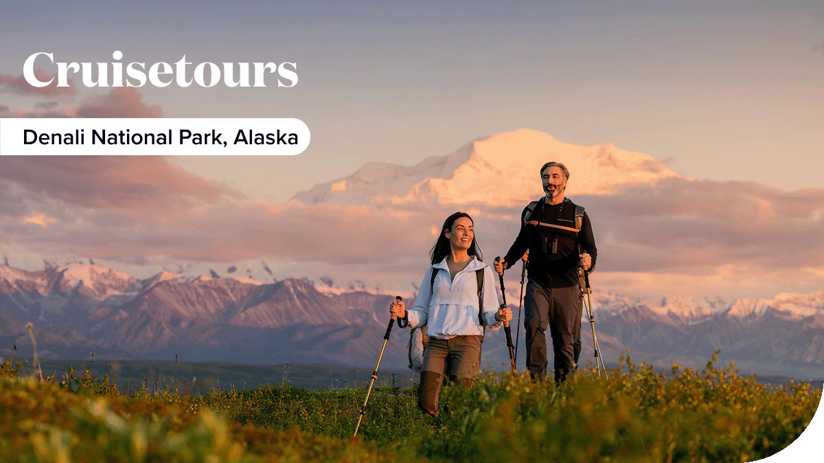 Two hikers enjoy the sunset in Denali National Park, Alaska