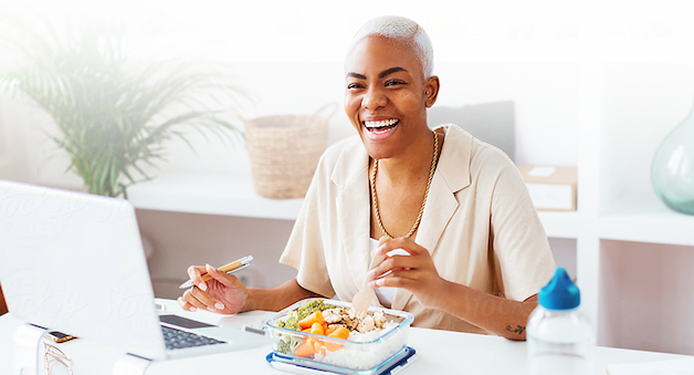 Woman eating at her desk