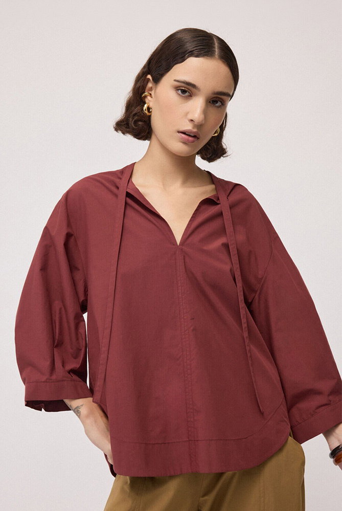 Blusa con fiocco al collo