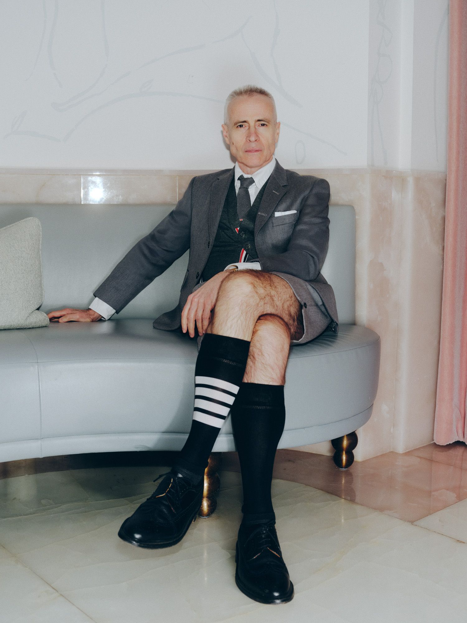 Thom Browne wearing a shorts suit and knee socks