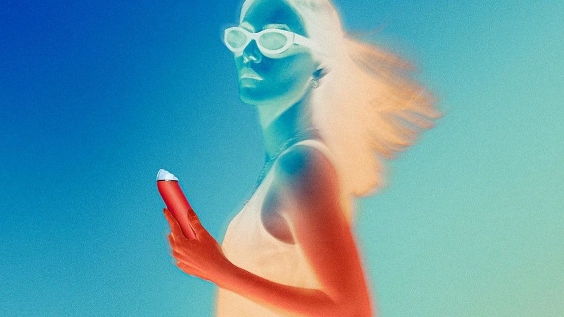 Thermal camera-image of woman holding portable fan