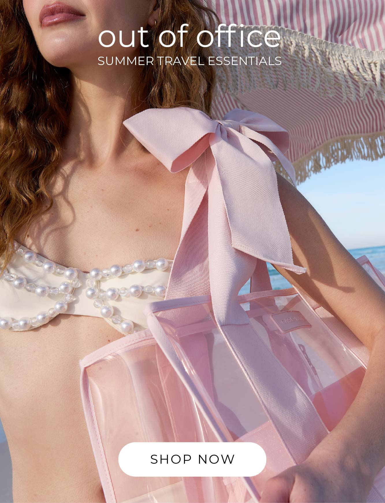 A close up of the Ballet Pink Bow Jelly Tote on the shoulder of a woman at the beach.