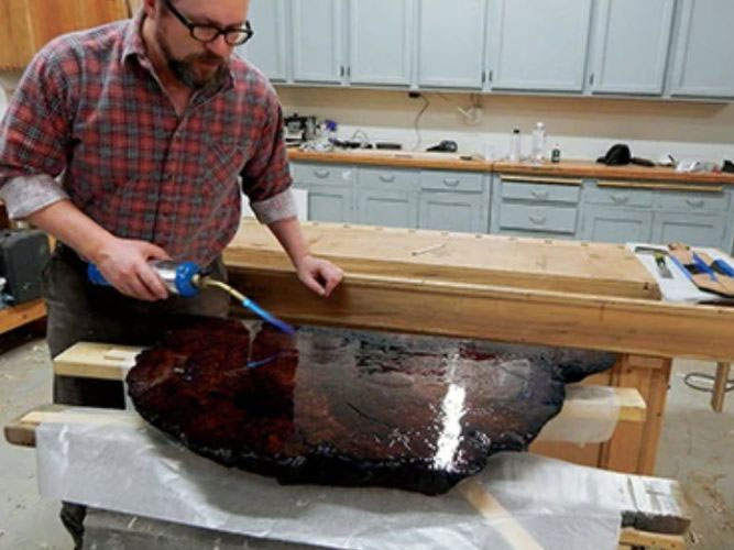 Smoothing epoxy pour with flame