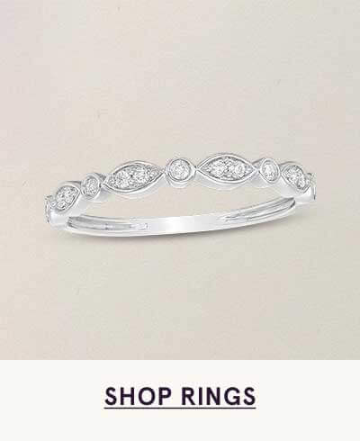 White-metal band with alternating marquise & round-shaped frames set with diamonds. Click here to shop rings