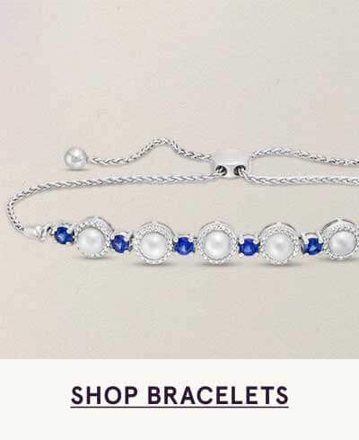Silver bolo bracelet with halo-framed pearls & blue gemstones.  Click here to shop bracelets