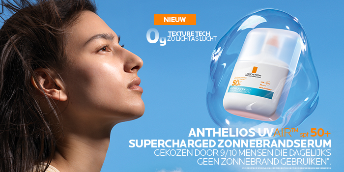 Profile of woman basking in sun beside Anthelios UV Air SPF 50+ sun protection serum bottle inside transparent bubble on blue sky background