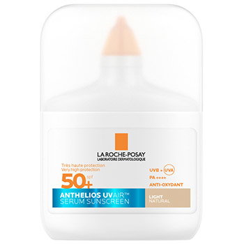 La Roche-Posay Anthelios UVMune serum sunscreen SPF50+ in light natural shade, small travel-size white bottle with orange cap