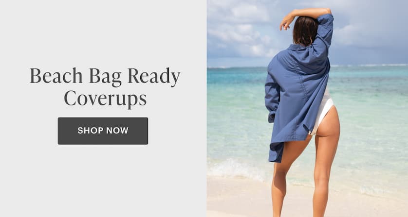 Beach Bag Ready Coverups - Woman in blue coverups over white swim standing in front of water. 