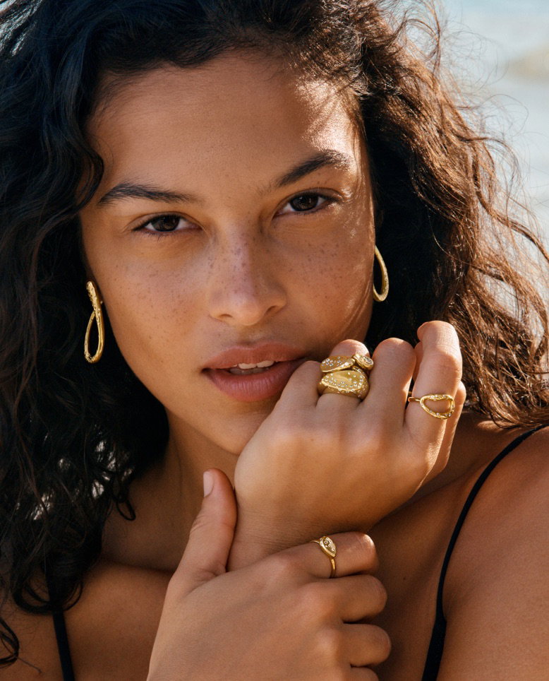  A model poses in 14k gold-plated Pandora jewellery.