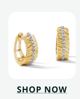 Pair of textured gold huggies with central vertical stripe of pavé set diamonds.Click here to shop now