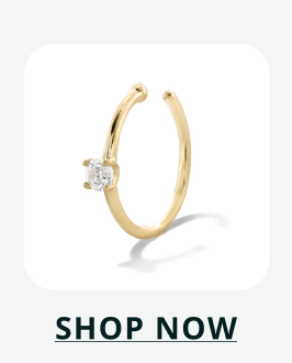 Delicate gold faux hoop/ear cuff with small, single round cut diamond accent. Click here to now