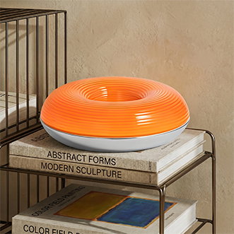 Lámpara LED de mesa/pared Fjora de Lindby, naranja/cromo, Ø30 cm, atenuable.