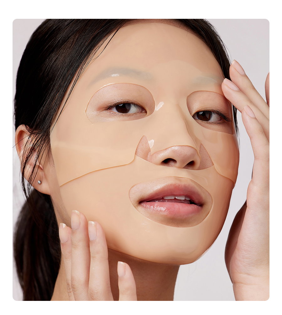 A woman wears the Overnight Recovery Mask