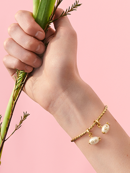 Close up of a bracelet with Pandora Wonders charms