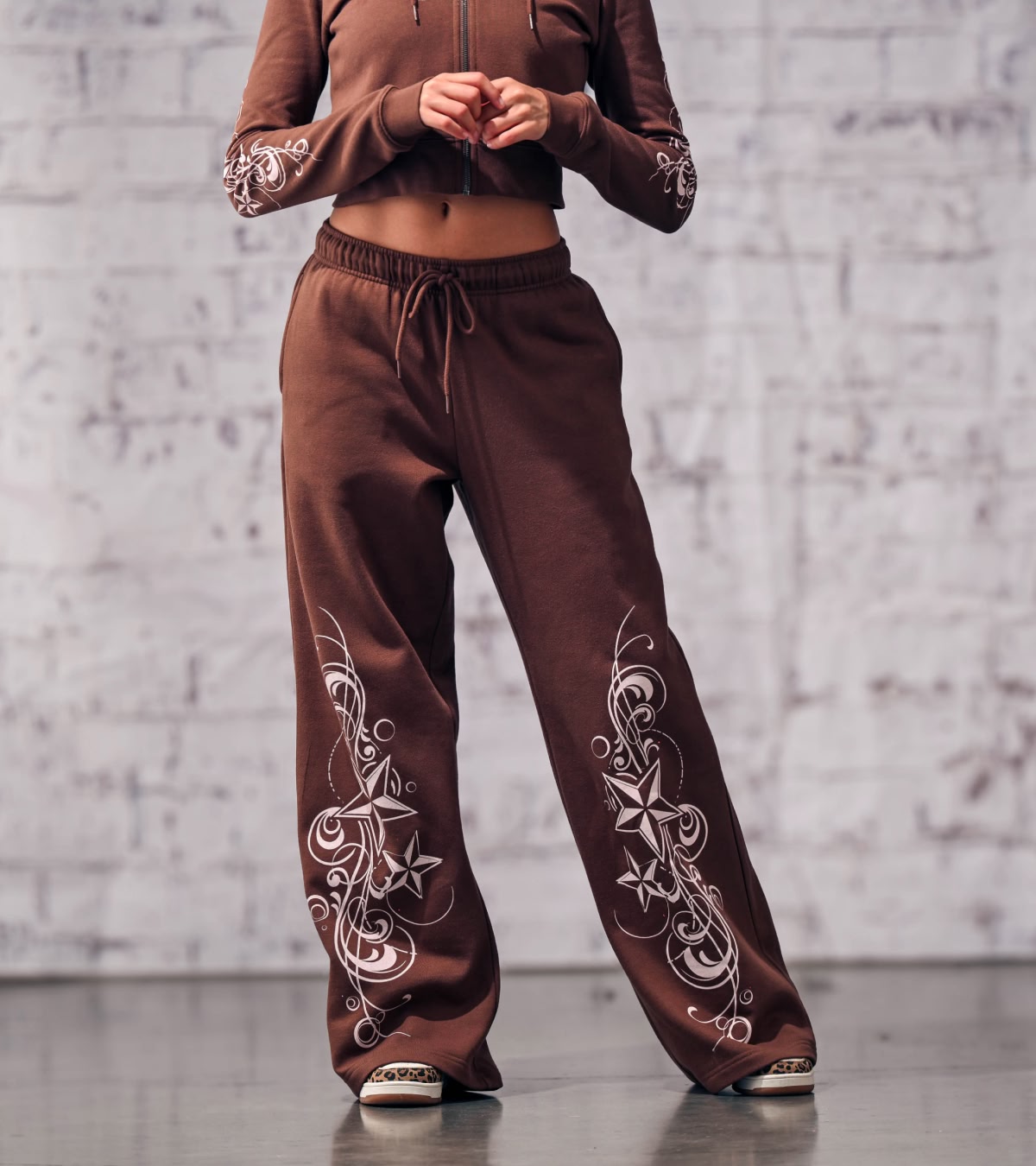 Shop women's pants, featuring velour sweatpants from Empyre