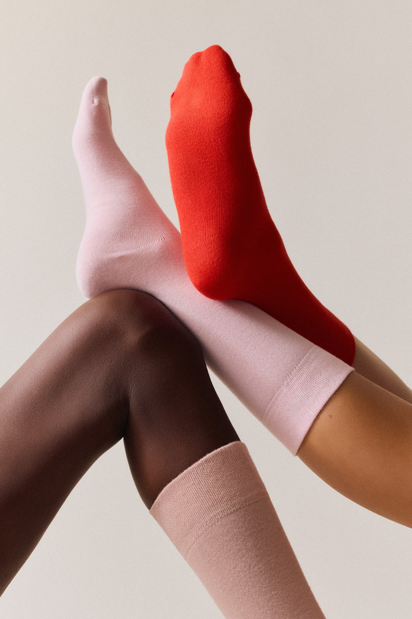 Three bamboo socks in pink and red 
