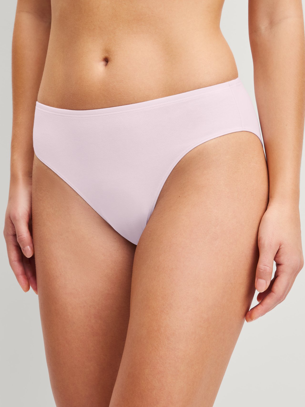 Women model is wearing Brief, regular cut made of Cotton in Pink, Unicoloured from the Essential Cotton series by CALIDA, Front view