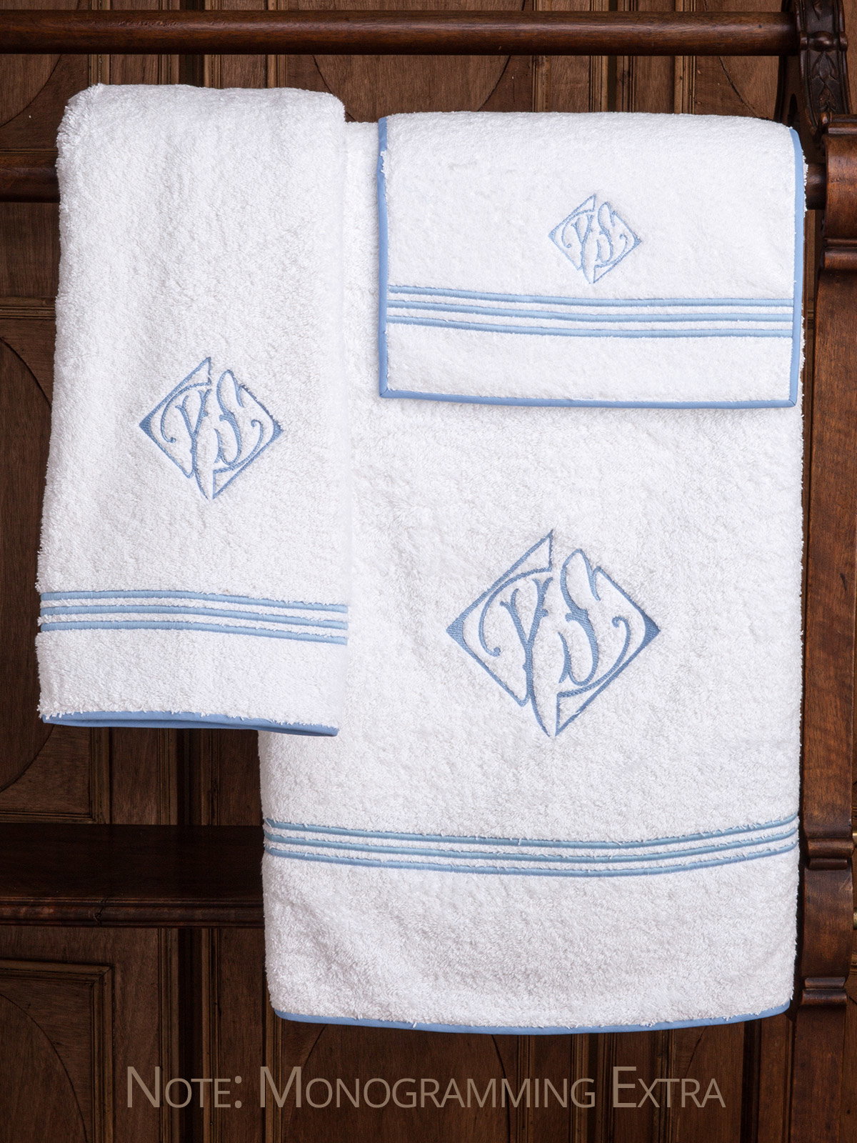 Classic, pure linen guest towels are the height of luxury with crisp, three line embroidery underlined with a narrow zig-zag finish and flanged for simple elegance