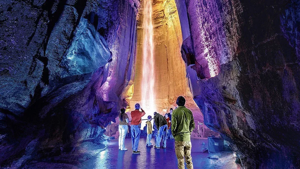 Image description: Tourists viewing waterfall at Ruby Falls.