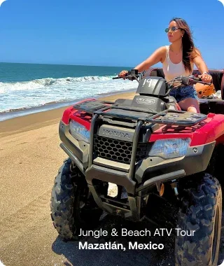 Woman riding an ATV along the beach in Mazatlán, Mexico.