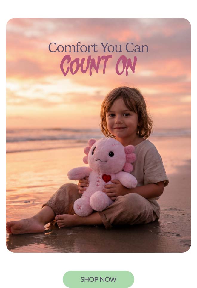 A little kid holding Scary Cute Axolotl Warmies on a beach. Shop Now.