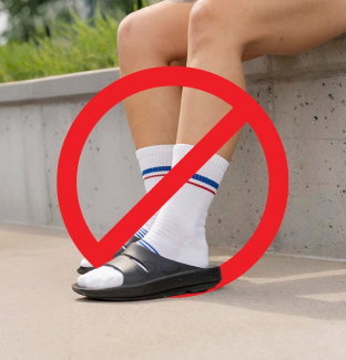Read the blog - a red circle and slash over the same image of white socks and sandals