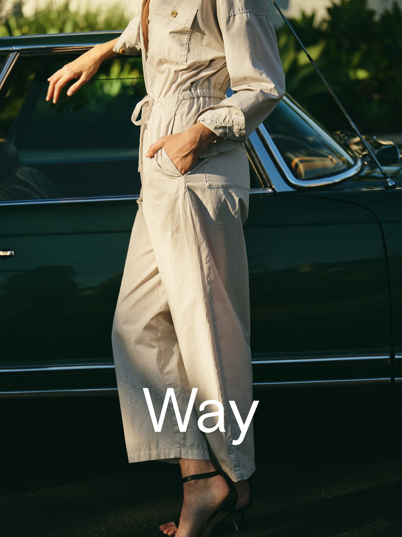 Woman in jumpsuit with word "Way" over top