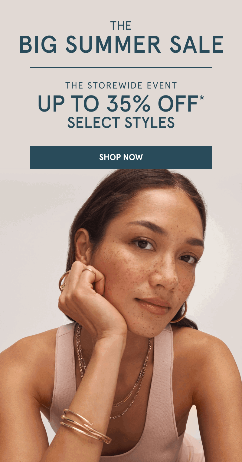 Woman wearing yellow gold hoops, chains and bracelets. The big summer sale. Up to 35% Off select styles. Click shop now.