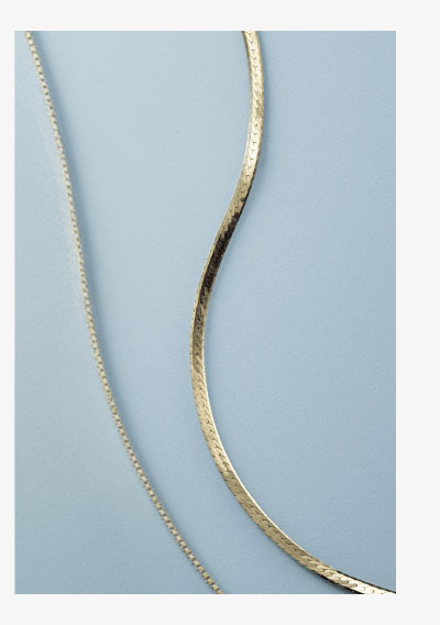 Yellow gold chain necklaces with herringbone and box chain designs.