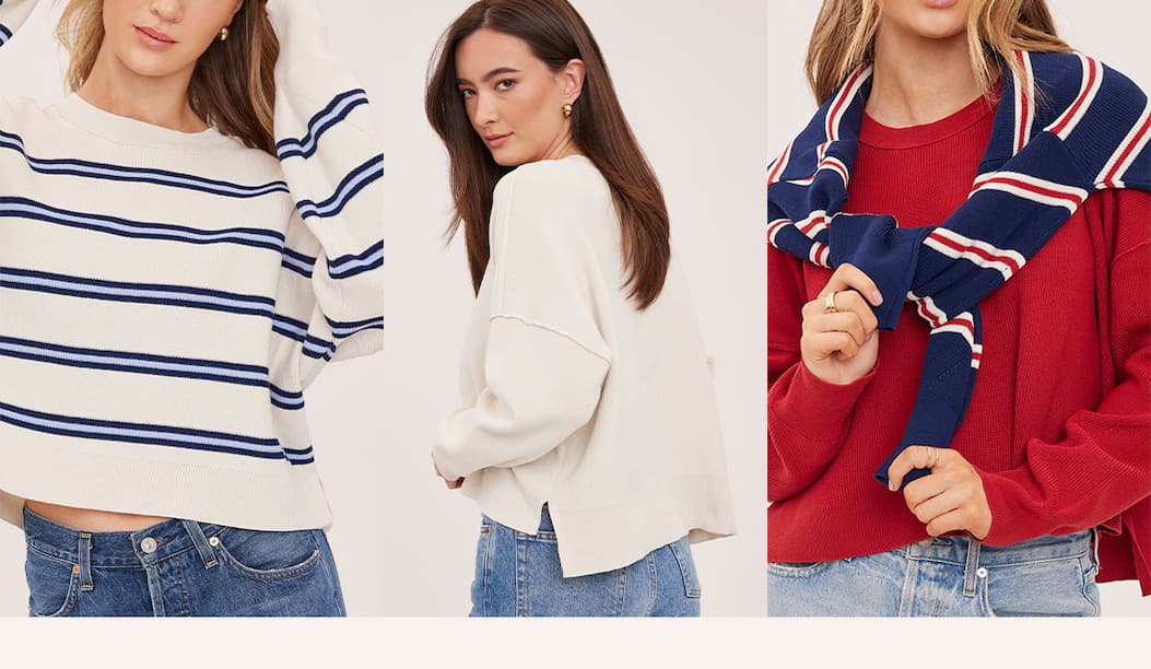 Three models wearing the Echo Pullover in cream, ivory, and red colorways with denim.