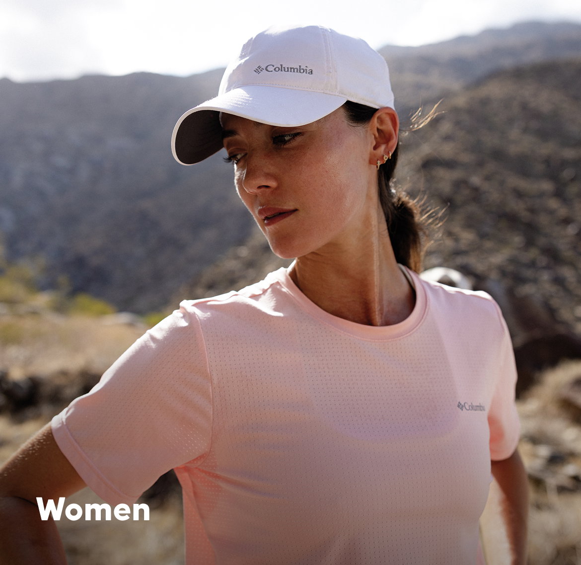 Woman hiking in hot, sunny weather. 